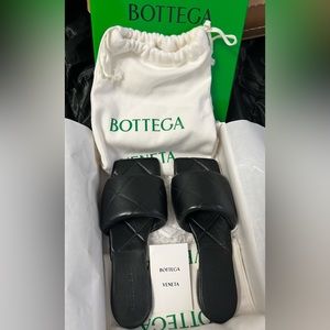 Bottega Veneta leather slides.